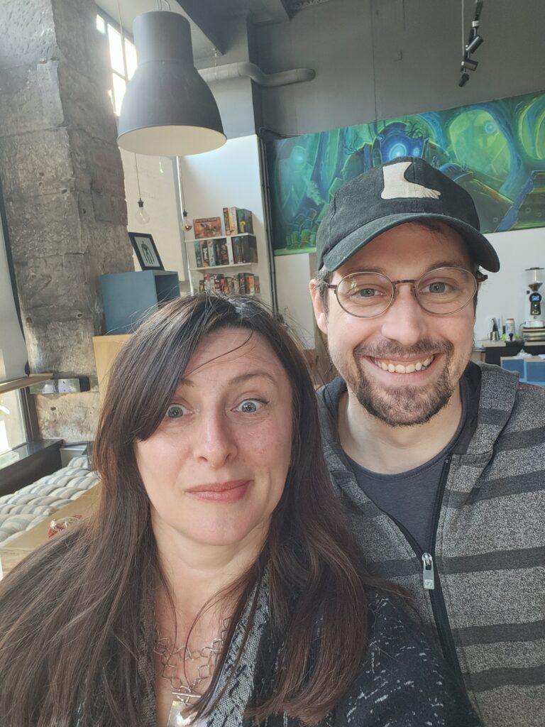 Photo of Aleksandra and the shop owner of Ancient Robot Games