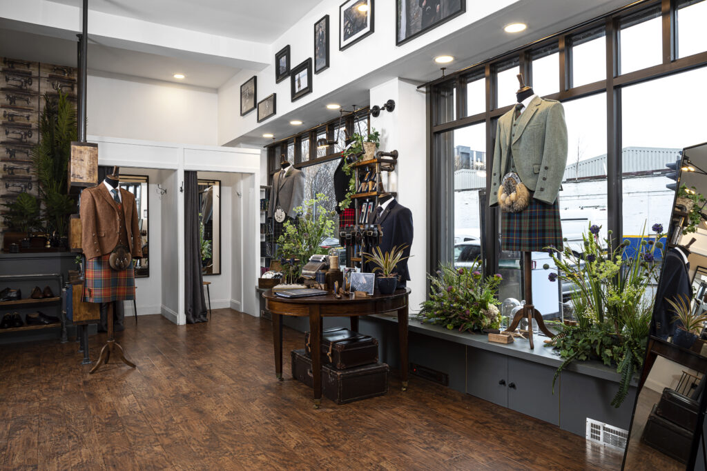 Shop interior of kilt/men's tailoring with wooden flooring.